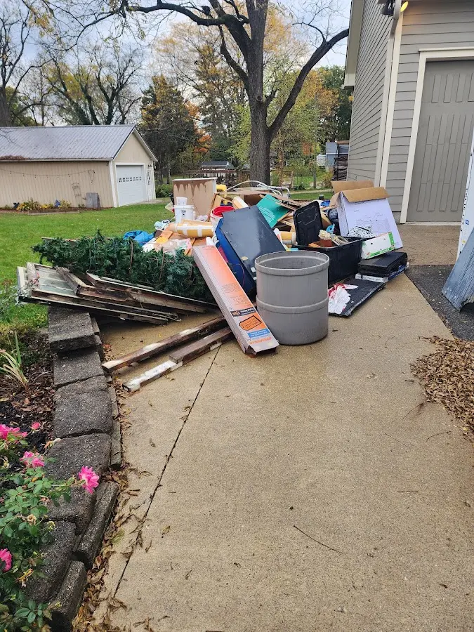Dumpster being loaded with debris for Roofing Dumpster Rental in Accokeek